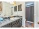 Bathroom features a single sink vanity with a framed mirror and a shower/tub combo at 8719 Sweet Sage Ln, Charlotte, NC 28227