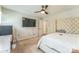 Bright bedroom featuring a comfortable bed, and a ceiling fan, offering a versatile space at 8719 Sweet Sage Ln, Charlotte, NC 28227