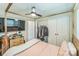 Bedroom featuring a four-poster bed, ceiling fan, TV, and closet, offering a cozy and functional space at 8719 Sweet Sage Ln, Charlotte, NC 28227