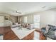 Inviting living area with hardwood floors, modern furniture, and a staircase visible, creating a welcoming space at 8719 Sweet Sage Ln, Charlotte, NC 28227