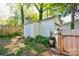 Cozy backyard featuring a storage shed, wood fence, and well-maintained landscaping at 902 Hawthorne Rd, Shelby, NC 28150