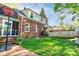 A brick home with a basketball hoop and a well-manicured lawn and landscaping at 902 Hawthorne Rd, Shelby, NC 28150