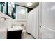 The bathroom has tiled walls, a vanity sink, and a shower-tub combo at 902 Hawthorne Rd, Shelby, NC 28150