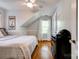 Bedroom featuring hardwood floors and natural light from a window, along with an athletic theme at 902 Hawthorne Rd, Shelby, NC 28150