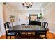 Dining room with hardwood floors, black furniture, and natural lighting at 902 Hawthorne Rd, Shelby, NC 28150