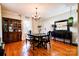 Elegant dining room with hardwood floors, hutch, and black accent furniture at 902 Hawthorne Rd, Shelby, NC 28150