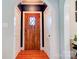 Interior entryway featuring hardwood floors, detailed door, and white trim at 902 Hawthorne Rd, Shelby, NC 28150