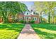 Charming brick home with manicured lawn and inviting brick walkway at 902 Hawthorne Rd, Shelby, NC 28150