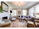 Bright living room with fireplace, large windows, and comfortable seating at 902 Hawthorne Rd, Shelby, NC 28150