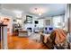 Open living room with fireplace, hardwood floors, and stylish decor at 902 Hawthorne Rd, Shelby, NC 28150