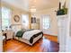 A bright main bedroom features hardwood floors, a fireplace, and ample natural light at 902 Hawthorne Rd, Shelby, NC 28150