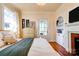 The main bedroom has hardwood floors, a fireplace, and a chandelier at 902 Hawthorne Rd, Shelby, NC 28150