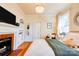 This main bedroom has a fireplace, built-in shelving, and updated fixtures at 902 Hawthorne Rd, Shelby, NC 28150