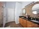 Bathroom featuring double sinks, granite countertops, and mosaic tile backsplash at 908 Carole Summey Dr, Dallas, NC 28034