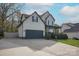 Traditional two-story home with an attached two-car garage and a welcoming front porch at 908 Carole Summey Dr, Dallas, NC 28034