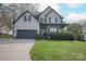 Charming two-story home featuring a well-manicured lawn and a two-car garage at 908 Carole Summey Dr, Dallas, NC 28034