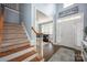 Inviting foyer with staircase leading to an open floor plan with lots of natural light at 908 Carole Summey Dr, Dallas, NC 28034