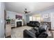 Comfortable living room with a cozy fireplace, large TV, and plush leather seating at 908 Carole Summey Dr, Dallas, NC 28034