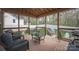 Inviting screened-in porch with comfortable seating and view of the backyard at 908 Carole Summey Dr, Dallas, NC 28034