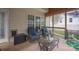 Cozy screened-in porch with comfortable seating, a coffee table, and a backyard view at 908 Carole Summey Dr, Dallas, NC 28034