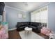Bright play area features natural light, playroom furniture, and light blue paint at 908 Carole Summey Dr, Dallas, NC 28034