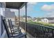 Relaxing porch view with rocking chairs overlooking the charming neighborhood street at 908 Carole Summey Dr, Dallas, NC 28034