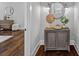 Decorated entryway featuring a cabinet with sliding doors, modern decor, and hardwood floors at 911 Naples Dr, Davidson, NC 28036