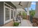 Inviting front porch with comfortable seating and peaceful neighborhood views, adorned with a decorative rug and potted flowers at 911 Naples Dr, Davidson, NC 28036