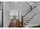 Entryway with hardwood floors and stairs to the second level at 911 Naples Dr, Davidson, NC 28036