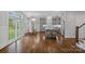 Modern kitchen with gray cabinetry, stainless steel appliances, island, and a dining area near the patio doors at 911 Naples Dr, Davidson, NC 28036
