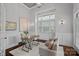 Bright home office with wainscoting, a large window, and neutral decor for a productive workspace at 911 Naples Dr, Davidson, NC 28036