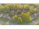 Stunning aerial view showcasing the home's prime location nestled among mature trees in a beautiful neighborhood at 9927 Clarkes View Nw Pl, Concord, NC 28027