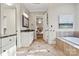 Well-appointed bathroom with double vanity, soaking tub, granite countertops, and tile flooring at 9927 Clarkes View Nw Pl, Concord, NC 28027