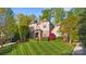Beautiful home with pristine lawn, verdant landscaping, and classic façade at 9927 Clarkes View Nw Pl, Concord, NC 28027