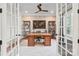 Sophisticated office with built-in shelving, hardwood desk, and abundant light at 9927 Clarkes View Nw Pl, Concord, NC 28027