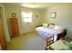 Bedroom with a single bed, wood floors, and natural light at 1014 Stuart Dr, Wadesboro, NC 28170