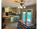 Cozy kitchen features an adjacent dining area, a breakfast bar, and backyard access at 1014 Stuart Dr, Wadesboro, NC 28170