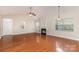 Bright living room boasts vaulted ceilings, fireplace, and ample natural light from large windows at 10318 Caldwell Depot Rd, Cornelius, NC 28031