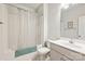 Clean and bright bathroom with a shower-tub, single sink vanity, and neutral color scheme at 10378 Ambercrest Nw Ct, Huntersville, NC 28078