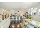 Bright open-concept dining area and kitchen with a breakfast bar and modern decor at 10378 Ambercrest Nw Ct, Huntersville, NC 28078