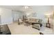 Comfortable living room with a sectional sofa, decorative chairs, and a warm, inviting atmosphere at 10378 Ambercrest Nw Ct, Huntersville, NC 28078