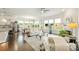 Bright and airy living room with large windows, a fireplace, and hardwood floors at 10378 Ambercrest Nw Ct, Huntersville, NC 28078