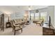 Spacious living room with neutral tones, comfortable seating, and ample natural light at 10378 Ambercrest Nw Ct, Huntersville, NC 28078