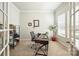 Bright office space with natural light, a modern desk setup, and ample storage, perfect for remote work at 10378 Ambercrest Nw Ct, Huntersville, NC 28078
