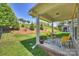 Inviting covered patio featuring comfortable seating and views of the landscaped backyard at 10378 Ambercrest Nw Ct, Huntersville, NC 28078