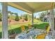 Relaxing covered patio with seating, perfect for enjoying the serene outdoor scenery at 10378 Ambercrest Nw Ct, Huntersville, NC 28078
