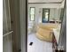 A bathroom featuring a shower, toilet, tub, vanity, and a mirror at 105 Branson Dr, Olin, NC 28660