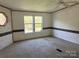 Bedroom features two windows and a ceiling fan at 105 Branson Dr, Olin, NC 28660
