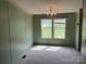 Dining room with carpet, chandelier, and views from its two windows at 105 Branson Dr, Olin, NC 28660