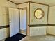 Bright entryway featuring an octagonal window, a door, and neutral wall colors at 105 Branson Dr, Olin, NC 28660